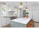 Well-lit kitchen features a large island, stainless steel appliances, custom cabinetry, and modern fixtures at 1119 Simmons St, Mount Pleasant, SC 29464