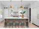 Elegant kitchen with a central island, pendant lights, stainless appliances, and ample cabinet space at 1119 Simmons St, Mount Pleasant, SC 29464