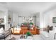 Open-concept living room showcasing hardwood floors, a leather sofa, and seamless flow to the kitchen at 1119 Simmons St, Mount Pleasant, SC 29464