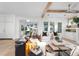 Open-concept living room featuring exposed beams, modern furniture, and abundant natural light at 1119 Simmons St, Mount Pleasant, SC 29464