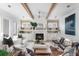 Cozy living room with a fireplace, built-in shelving, and comfortable seating arrangements at 1119 Simmons St, Mount Pleasant, SC 29464