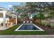 Backyard featuring a modern rectangular pool, lush landscaping, and outdoor seating at 1119 Simmons St, Mount Pleasant, SC 29464