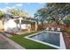 Relaxing pool area with lounge chairs, an outdoor dining area, and lush greenery at 1119 Simmons St, Mount Pleasant, SC 29464
