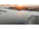 Aerial view of homes with beach and bay views at sunset at 112 Ocean Blvd, Isle of Palms, SC 29451
