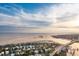 A scenic aerial view of a charming coastal neighborhood with waterfront homes, beaches, and lush greenery at 112 Ocean Blvd, Isle of Palms, SC 29451
