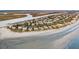 An aerial view of a beautiful coastal community featuring oceanfront homes and sandy beaches at 112 Ocean Blvd, Isle of Palms, SC 29451