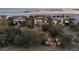 Luxury beach house with mature trees and manicured landscaping offers stunning views of the ocean at 112 Ocean Blvd, Isle of Palms, SC 29451