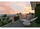 Relax on this balcony with a beach view, and a table and chairs set for outdoor living at 112 Ocean Blvd, Isle of Palms, SC 29451