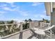 Balcony with beach view has outdoor seating and a metal wire railing surrounding the perimeter at 112 Ocean Blvd, Isle of Palms, SC 29451