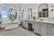 Elegant bathroom with freestanding tub, dual vanities and a view of palm trees outside the large window at 112 Ocean Blvd, Isle of Palms, SC 29451