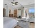 This beautiful bedroom features balcony access with ocean views and a ceiling fan at 112 Ocean Blvd, Isle of Palms, SC 29451