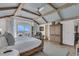 This bedroom has hard wood floors, a ceiling fan, a sliding glass door and a light blue ceiling at 112 Ocean Blvd, Isle of Palms, SC 29451