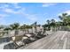 Relaxing deck with beach views featuring lounge chairs and white railing at 112 Ocean Blvd, Isle of Palms, SC 29451