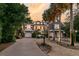 Charming home with a brick driveway, lush landscaping, and inviting outdoor lighting creating a warm ambiance at 112 Ocean Blvd, Isle of Palms, SC 29451
