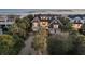 An impressive home boasts lush landscaping, a sprawling driveway, and peek-a-boo ocean views at 112 Ocean Blvd, Isle of Palms, SC 29451