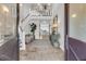 A grand foyer with high ceilings, elegant staircase, and views through to the living room at 112 Ocean Blvd, Isle of Palms, SC 29451