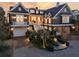A stately home with a manicured front yard, a circular driveway, and a grand entrance at 112 Ocean Blvd, Isle of Palms, SC 29451