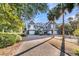 Beautiful home with a large driveway, three-car garage, and manicured landscaping at 112 Ocean Blvd, Isle of Palms, SC 29451