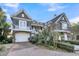 Well-maintained home with an oversized driveway, three-car garage, and beautiful landscaping at 112 Ocean Blvd, Isle of Palms, SC 29451