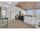 Hallway with wooden beam ceiling, staircase, and a chair next to a chest of drawers at 112 Ocean Blvd, Isle of Palms, SC 29451