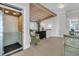 Hallway with elevator, wooden beam ceiling, staircase, and a chair next to a chest of drawers at 112 Ocean Blvd, Isle of Palms, SC 29451