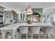 Kitchen island with countertop seating, stainless steel appliances, and custom cabinetry at 112 Ocean Blvd, Isle of Palms, SC 29451