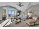 Bright and airy living room with large windows showcasing ocean views and comfortable seating at 112 Ocean Blvd, Isle of Palms, SC 29451