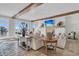 Bright living room featuring beamed ceilings, fireplace, comfortable seating, and scenic ocean views at 112 Ocean Blvd, Isle of Palms, SC 29451