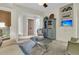Cozy living room with a large rug, comfortable seating and built-in shelving at 112 Ocean Blvd, Isle of Palms, SC 29451