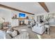 Elegant living room with fireplace, wood beams, comfortable seating, and stylish accents at 112 Ocean Blvd, Isle of Palms, SC 29451