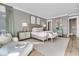 Spacious bedroom featuring a plush bed, soft lighting, and calming neutral tones at 112 Ocean Blvd, Isle of Palms, SC 29451