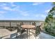 Relaxing patio with a table set overlooking the ocean at 112 Ocean Blvd, Isle of Palms, SC 29451