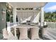 Outdoor dining area with grill and seating perfect for entertaining guests at 112 Ocean Blvd, Isle of Palms, SC 29451