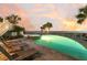 Backyard pool and jacuzzi offer plenty of lounging space, with a beach view and palm tree landscaping at 112 Ocean Blvd, Isle of Palms, SC 29451