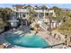 Luxury backyard featuring a beautiful pool, hot tub, lounging chairs and an entertaining space at 112 Ocean Blvd, Isle of Palms, SC 29451