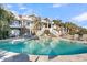 Stunning backyard pool with a hot tub and a spacious deck perfect for entertaining and relaxing by the water at 112 Ocean Blvd, Isle of Palms, SC 29451