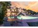 Beautiful outdoor space with a pool, hot tub, and comfortable seating, perfect for enjoying warm evenings at 112 Ocean Blvd, Isle of Palms, SC 29451