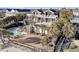 Luxury home featuring a multi-level deck with outdoor seating overlooking the lush yard and pool at 112 Ocean Blvd, Isle of Palms, SC 29451