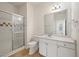 Bathroom with white vanity, sink, mirror, and enclosed glass shower at 130 River Landing Dr # 5108, Charleston, SC 29492