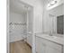 Well-lit bathroom with dual vanities and bathtub at 130 River Landing Dr # 5108, Charleston, SC 29492