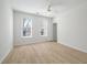 Bright bedroom with two windows and light wood floors at 130 River Landing Dr # 5108, Charleston, SC 29492