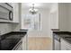 Dining area next to kitchen with chandelier and large window at 130 River Landing Dr # 5108, Charleston, SC 29492