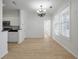 Bright dining room with neutral paint, light wood floors, and stainless steel appliances at 130 River Landing Dr # 5108, Charleston, SC 29492