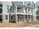 Exterior of townhome featuring double balconies and screened in patio and landscaping at 130 River Landing Dr # 5108, Charleston, SC 29492