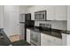Galley kitchen featuring stainless steel appliances, modern cabinetry, and dark countertops at 130 River Landing Dr # 5108, Charleston, SC 29492