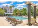 Resort-style swimming pool with lounge chairs and palm trees at 130 River Landing Dr # 5108, Charleston, SC 29492