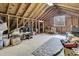 Finished attic space featuring wood paneling, window, carpet, and open layout at 135 Rapture Ln, Wando, SC 29492