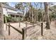 Expansive backyard featuring a wooden fence and mature trees, offering space for leisure at 135 Rapture Ln, Wando, SC 29492