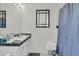 Well-lit bathroom with a clean aesthetic, showcasing modern fixtures and a shower at 135 Rapture Ln, Wando, SC 29492