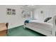 A cozy bedroom featuring a minimalist aesthetic with a large window, a small writing desk and carpet at 135 Rapture Ln, Wando, SC 29492